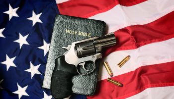 Gun and Bible on American Flag