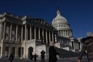 WASHINGTON DC - DECEMBER 15: Tourists gather around the US Cap