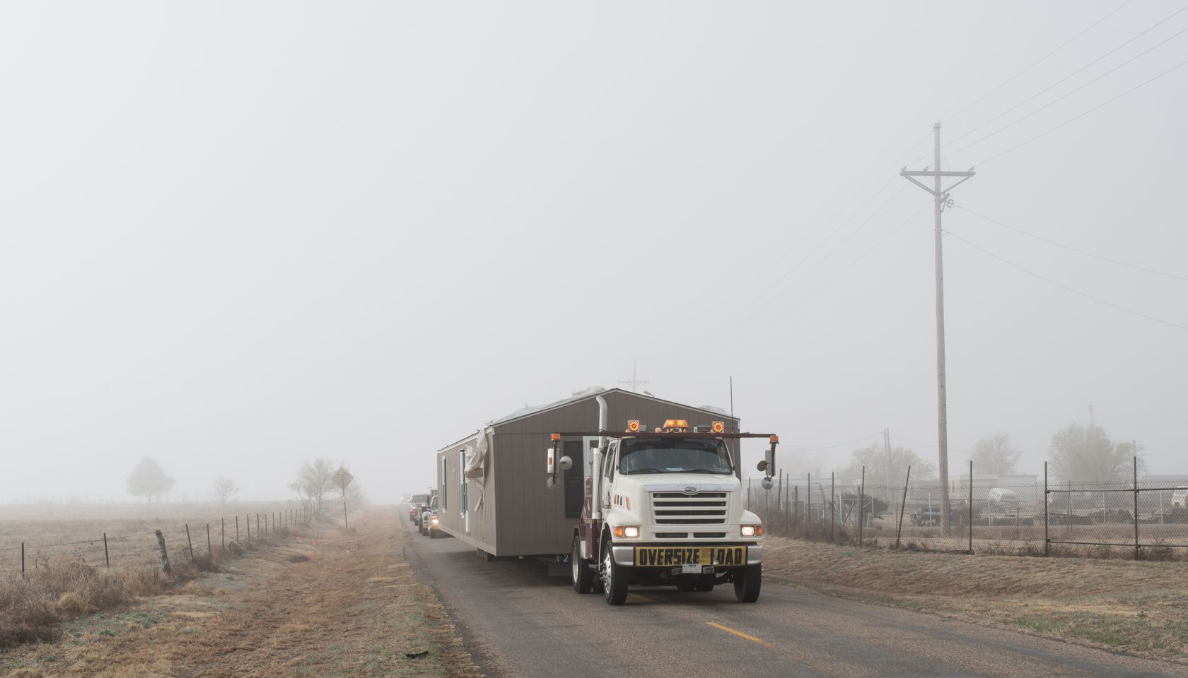 Truck transporting a house