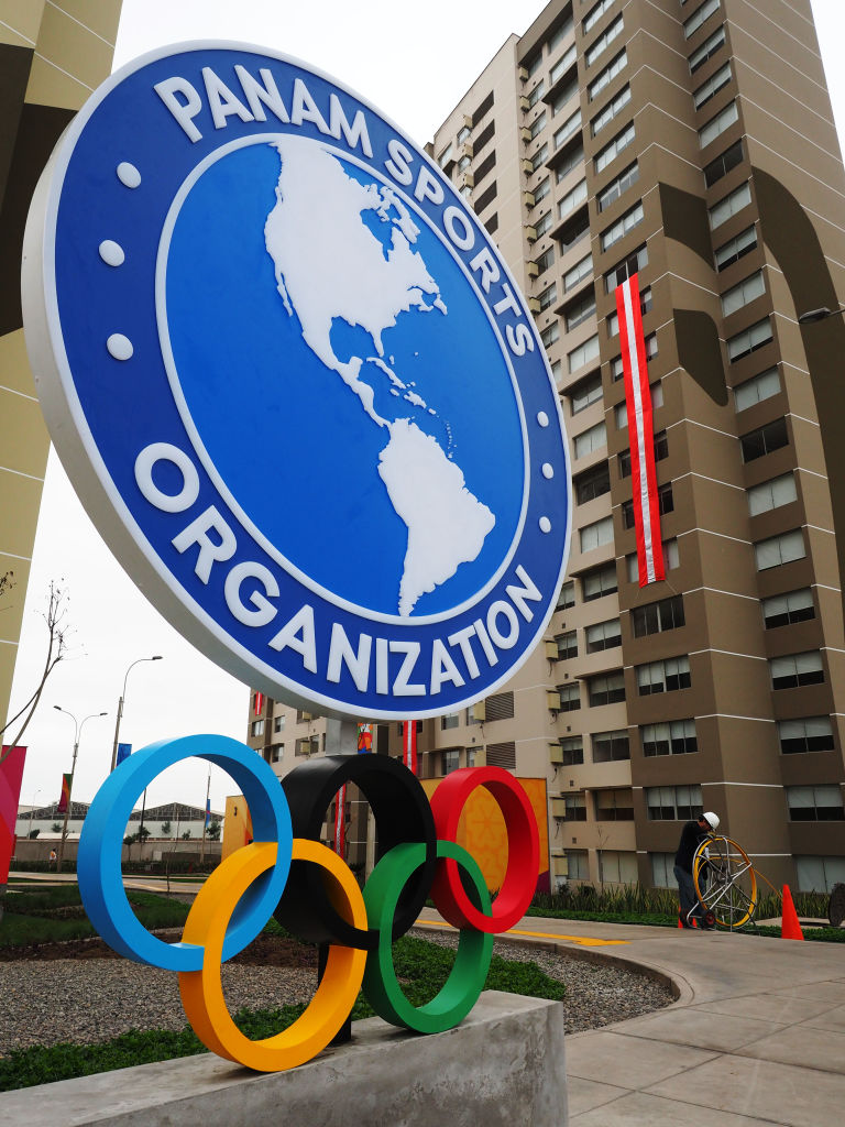 Panam Sports Organization logo and Olympic Rings in front of...