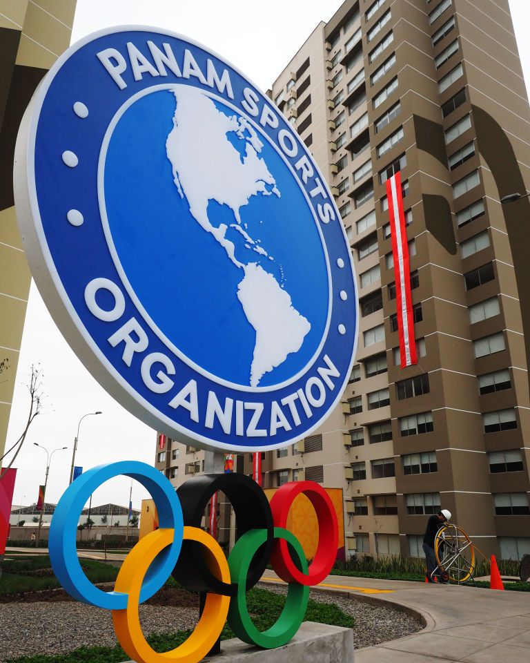 Panam Sports Organization logo and Olympic Rings in front of...