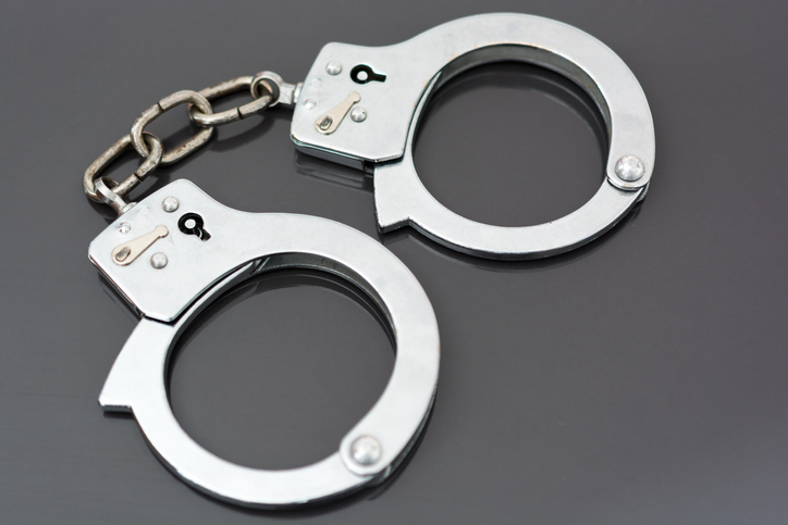 High Angle View Of Handcuffs On Table