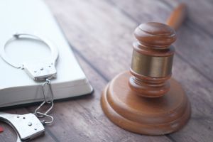 gavel and a book with handcuff