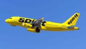 A Spirit Airlines Airbus 319 takes off from Los Angeles at...