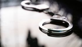 Close-Up Of Handcuffs On Table