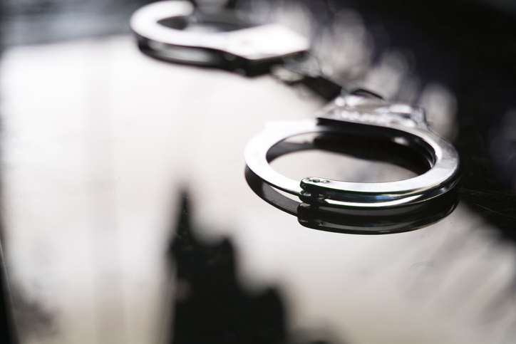 Close-Up Of Handcuffs On Table