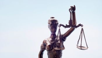 Lady Justice against blue background